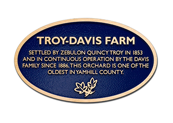 Blue background, circular farm dedication plaque